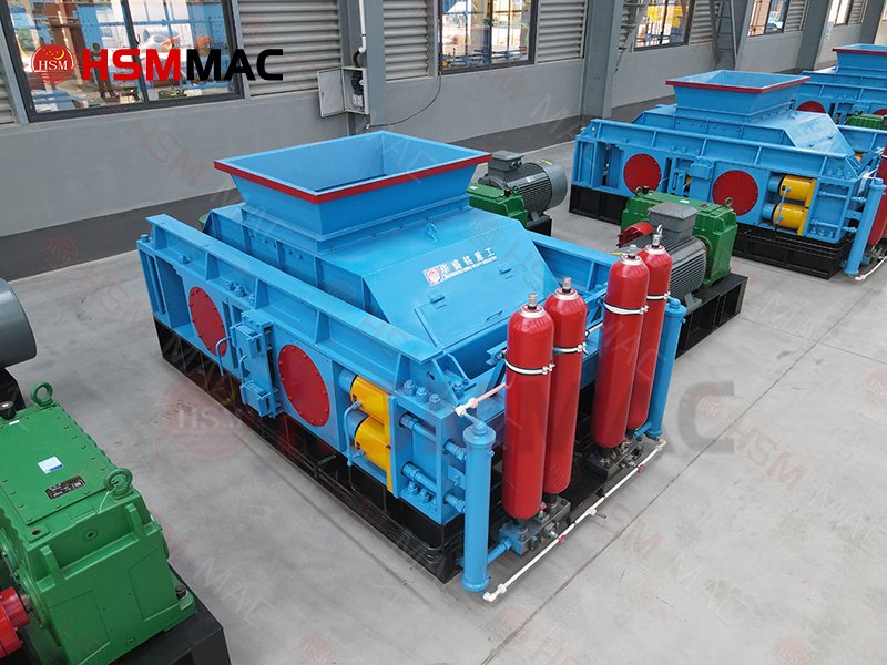 How does the hydraulic system protect the machine from hard foreign objects?